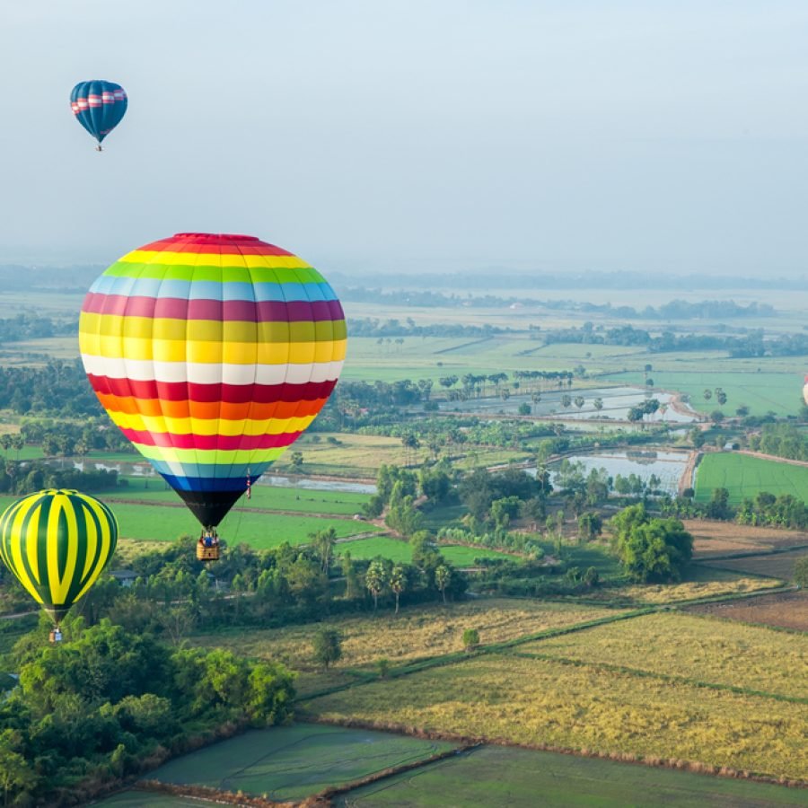 Colorful,Balloons,Over,Green,Rice,Field